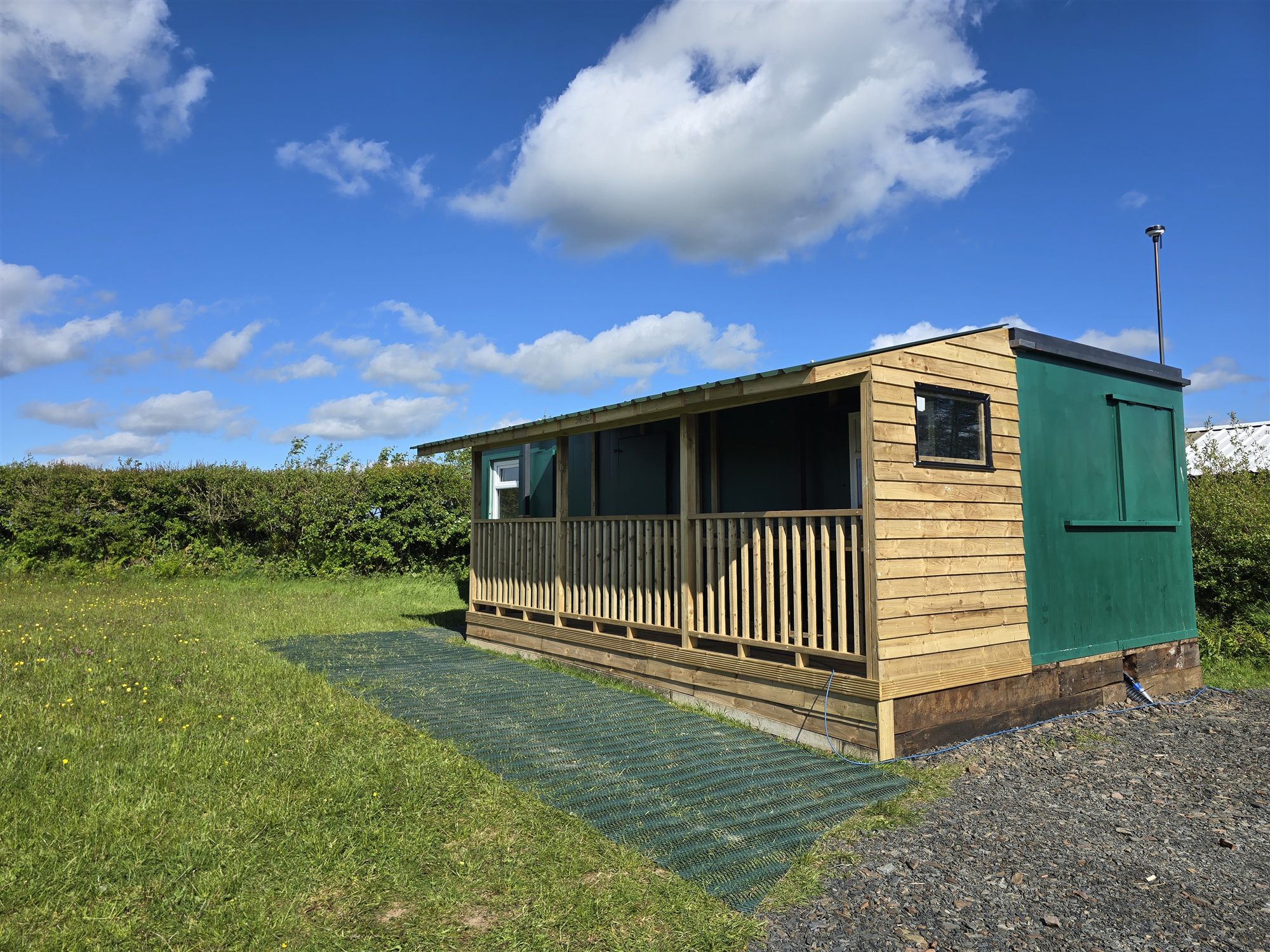 The shower block and facilities building beside the camping field.